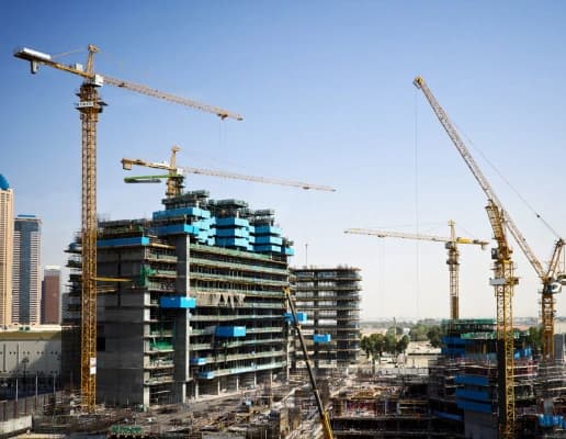 Construction site with cranes and buildings in progress